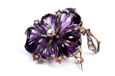 Lot 930 - A Victorian carved amethyst and diamond pendant/brooch