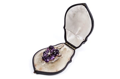 Lot 930 - A Victorian carved amethyst and diamond pendant/brooch