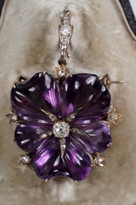 Lot 930 - A Victorian carved amethyst and diamond pendant/brooch