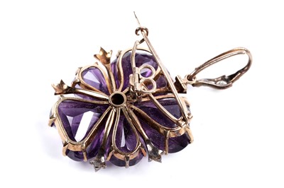 Lot 930 - A Victorian carved amethyst and diamond pendant/brooch