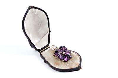 Lot 930 - A Victorian carved amethyst and diamond pendant/brooch