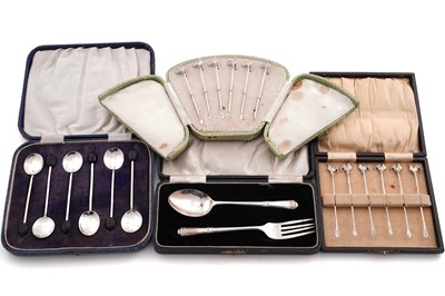 Lot 232 - A set of six George V silver cocktail sticks; and other silver flatware