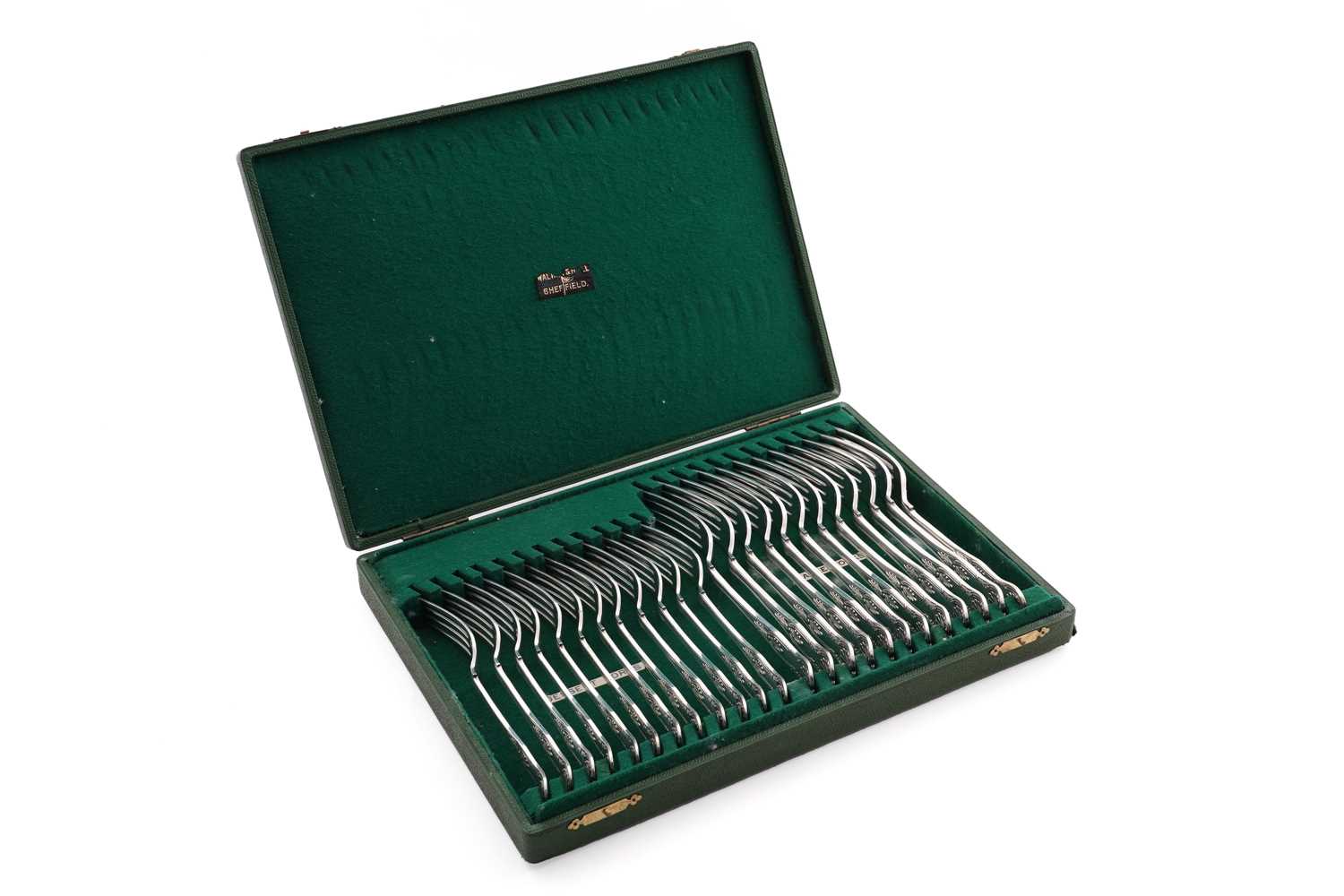 Lot 234 - George V eleven silver table forks and twelve silver dessert forks; and a later silver table fork