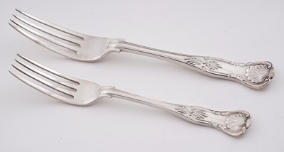 Lot 234 - George V eleven silver table forks and twelve silver dessert forks; and a later silver table fork