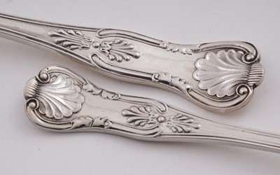 Lot 234 - George V eleven silver table forks and twelve silver dessert forks; and a later silver table fork
