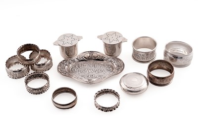 Lot 337 - An Edwardian silver pin dish; a pair of silver pepperettes; and a George III small silver snuff box