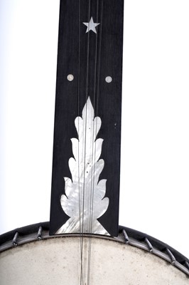 Lot 61 - A seven-string banjo