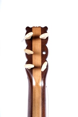 Lot 61 - A seven-string banjo