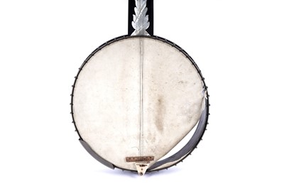 Lot 61 - A seven-string banjo