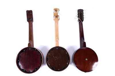 Lot 66 - Two ukulele banjos; and a mandolin banjo