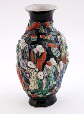 Lot 319 - A Chinese famille noir biscuit vase