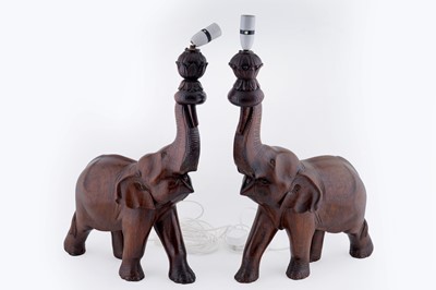 Lot 185 - A pair of mid-20th Century carved hardwood table lamps in the form of elephants