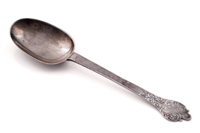 Lot 303 - A late Charles II silver lace-back trefid spoon