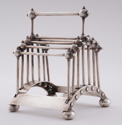 Lot 168 - An Edwardian arts and crafts silver toast rack