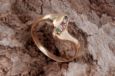 Lot 138 - A modern ruby, emerald, sapphire and diamond ring