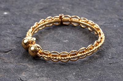 Lot 853 - A high carat yellow gold bangle