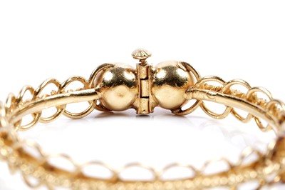 Lot 853 - A high carat yellow gold bangle