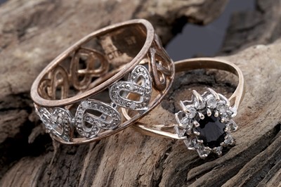 Lot 126 - A sapphire flowerhead pattern ring; and a diamond-set love heart pattern band