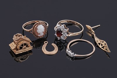 Lot 113 - Gold jewellery including: a novelty charm in the form of a watermill, and three rings