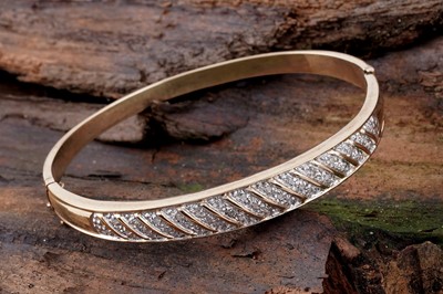 Lot 144 - A modern diamond set bangle