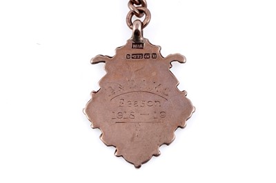 Lot 23 - An early 20th Century 9ct rose gold double "Albert" watch chain and fob