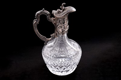 Lot 45 - A 20th Century continental silver mounted cut glass claret jug