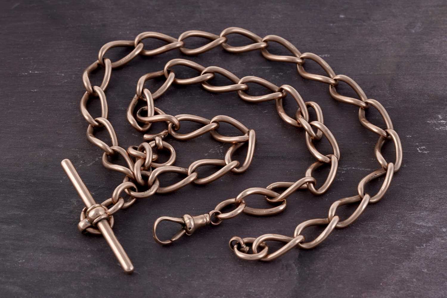 Lot 68 - A 9ct rose gold double "Albert" curb-link watch chain
