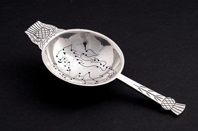 Lot 126 - A post war silver tea strainer