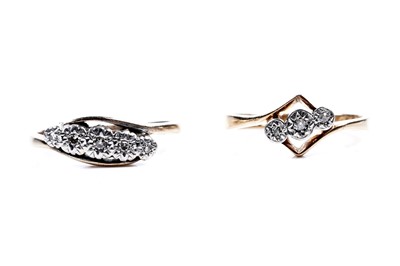 Lot 107 - Two mid-20th Century three-stone diamond rings