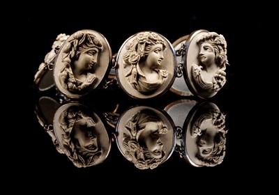 Lot 19 - A Victorian lava cameo bracelet; and one loose cameo