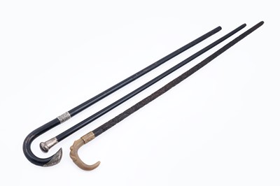 Lot 285 - A collection of three walking canes
