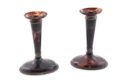 Lot 30 - A pair of George V silver mounted tortoiseshell candlesticks