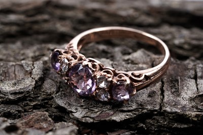 Lot 190 - An amethyst and white stone ring