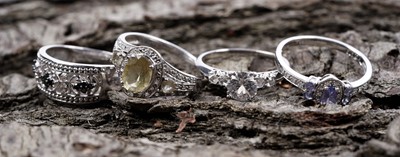 Lot 193 - Three 9ct white gold rings; and a palladium ring