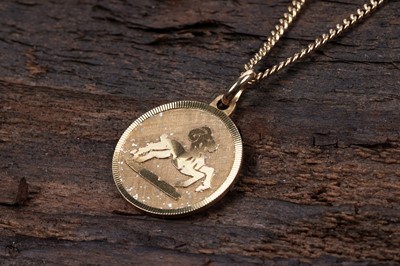 Lot 194 - A yellow gold Capricorn pendant