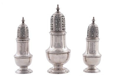 Lot 571 - A set of three George II silver casters