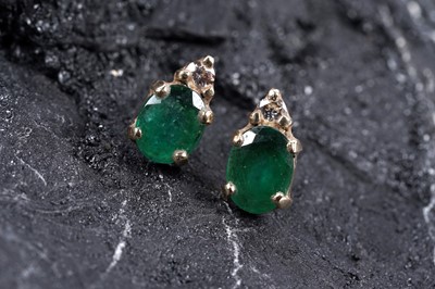 Lot 81 - A pair of emerald and diamond earrings