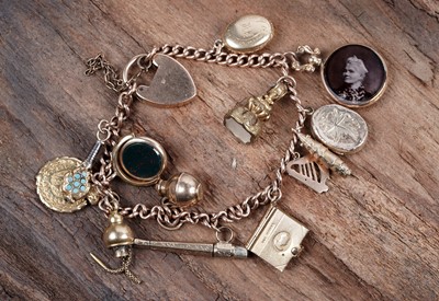 Lot 45 - A Victorian, Edwardian and later 9ct gold charm bracelet, with charm dated 'Xmas 1862'