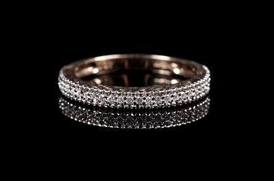 Lot 87 - A diamond half-hoop eternity ring