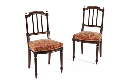 Lot 605 - A pair of late 19th Century French Empire-style brass mounted mahogany side chairs