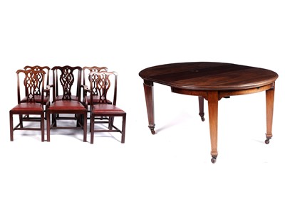 Lot 610 - An Edwardian circular mahogany extending dining table; and six chairs