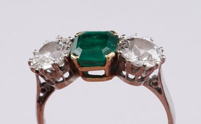 Lot 685 - A three stone emerald and diamond ring