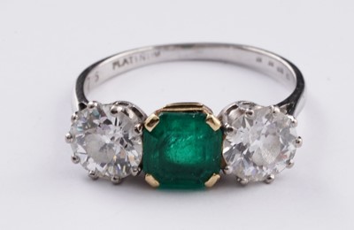 Lot 685 - A three stone emerald and diamond ring