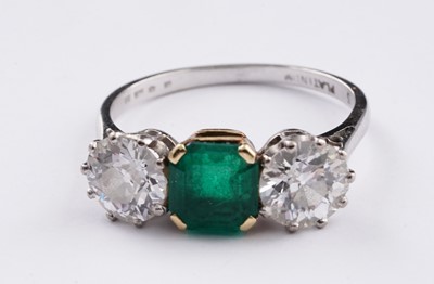 Lot 685 - A three stone emerald and diamond ring