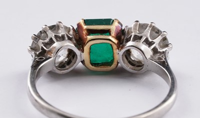 Lot 685 - A three stone emerald and diamond ring