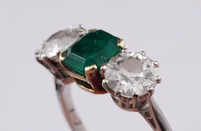 Lot 685 - A three stone emerald and diamond ring