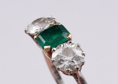 Lot 685 - A three stone emerald and diamond ring