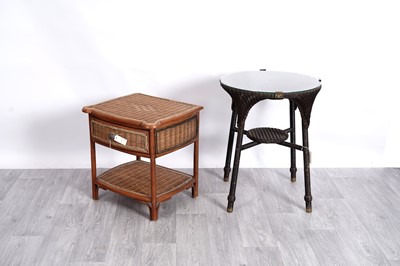 Lot 77 - In the manner of Lloyd Loom: a wicker circular garden table; and one other