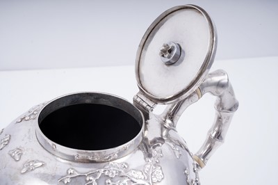 Lot 160 - A late 19th Century Chinese silver three-piece tea service; and a pair of silver sugar tongs