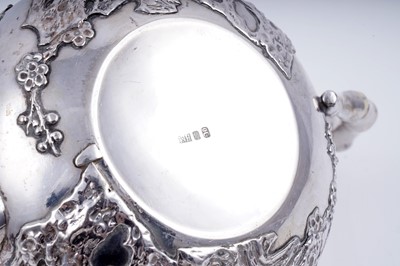 Lot 160 - A late 19th Century Chinese silver three-piece tea service; and a pair of silver sugar tongs